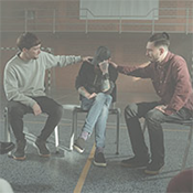 Young man receiving support from a counseling session