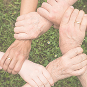 A photo of hands interlocking to symbolize trust